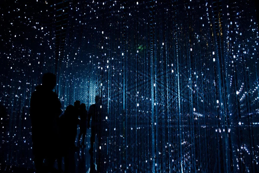 Dark background with blue illuminated coding language to signify AI
