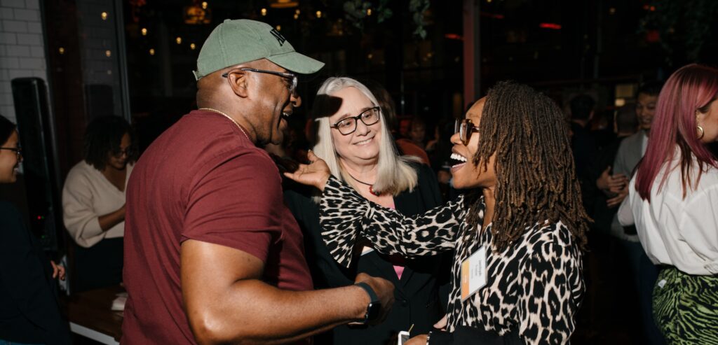 Council members smiling and embracing
