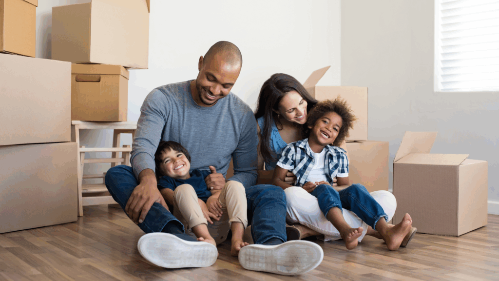 Young family among boxes on moving day