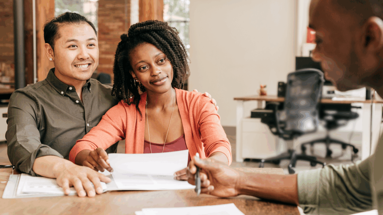 A young couple discussing a bank loan