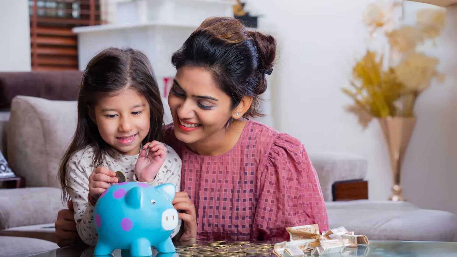 Mother and daughter saving money